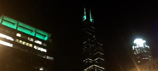 The Chicago skyline lit up in green during MidCamp 2016