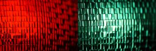 Color Theory: Mixed Signals (Jonathan Cohen) Red and green traffic signal lights, with the green light glowing.